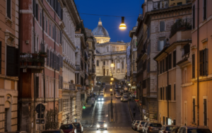 View of the Colosseum from Monti streets, highlighting the location difference in Monti or Trastevere for stay.